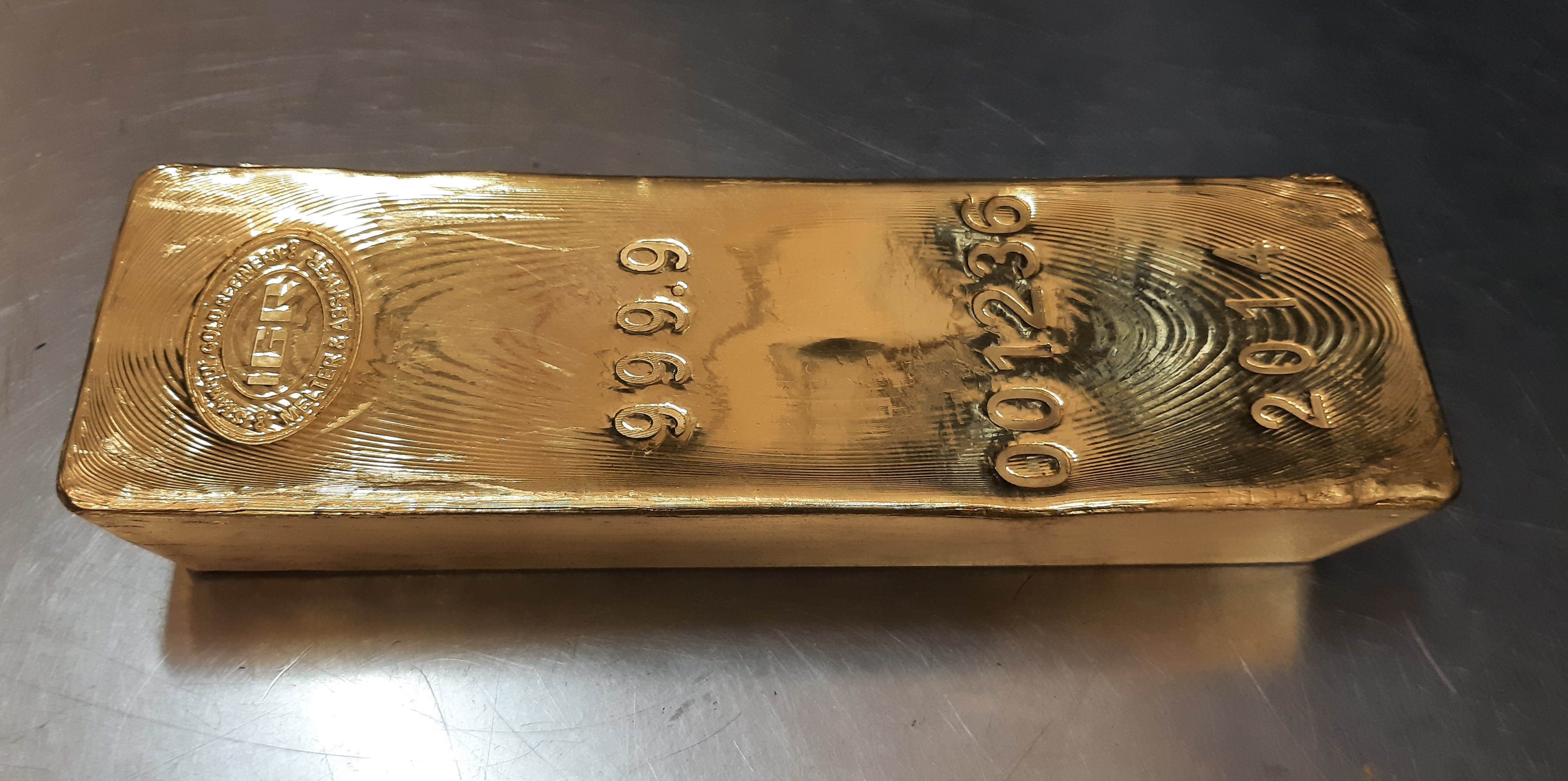 Gold bar 99.99% pure gold wholesale bar in a vault